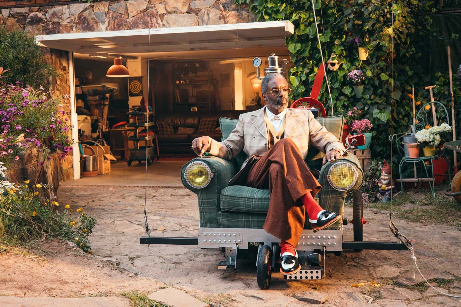 Man in a retro suit sitting in an armchair car outside a garage, Shredded Wheat shoot